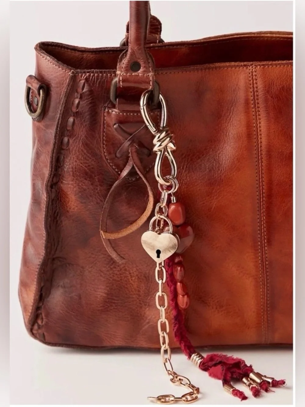 NWT Free People Semi Precious Charmed Strand Bag Charm Heart Lock Gold Red 12 in
